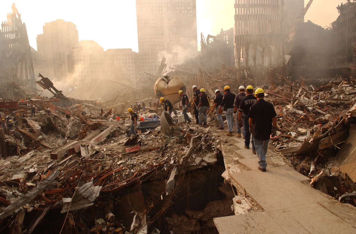 Members of NYPD enter the Trade Center site near the Sphere shortly after 9/11. Credit: Andrea Booher/FEMA