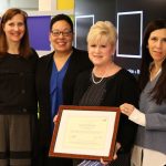 Jennifer Adams, Jackman, and Jeanette Guttierez presenting Cara Denbrock with her Teacher Award